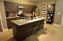 A modern kitchen featuring an elegant island, state-of-the-art appliances, and stylish decorative accents.