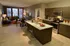 A modern open-concept kitchen and living room with polished finishes and an abundance of natural light.
