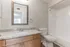 Stylish bathroom at Hampton Point Apartments with a sink, toilet, and shower, designed for convenience and ease.