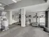 The fitness center at 500 Park Avenue Apartments, filled with treadmills and exercise equipment for an energizing workout.