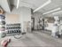 A well-equipped gym at 500 Park Avenue Apartments, complete with exercise machines and mirrors for a motivating atmosphere.
