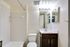 Bright bathroom in Allyson Garden Apartments, equipped with a toilet, sink, and shower for your comfort.