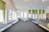 At Allyson Garden Apartments, a billiard table is set in a large room with vibrant green walls, perfect for socializing.