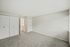 Bright and spacious bedroom featuring plush carpeting, two closets, and ample natural light.