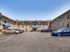 A welcoming view of the well-maintained Sequoia Manor Apartment complex featuring convenient parking and an inviting entrance.