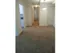 A cozy and inviting hallway with plush carpeting, leading to multiple rooms, softly illuminated by a modern ceiling light fixture.