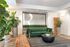 Chic lounge area with lush greenery, modern furniture, and stylish decor.