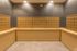 Elegant apartment mail room with patterned wallpaper and neatly arranged mailboxes.