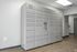 Modern package locker system installed in a clean, bright hallway, enhancing secure parcel delivery solutions.