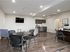A spacious open-concept living and dining area featuring modern furnishings and elegant hardwood flooring, perfect for contemporary living.