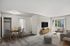 A bright and modern open-concept living area featuring stylish furniture, a flat-screen TV and a dedicated dining space, perfect for modern living.