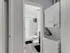 An in-unit washer and dryer, conveniently located next to a stylish full bathroom.