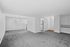 An empty room captured in black and white at The Greenbriar Apartments, highlighting its clean lines and open space.