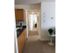 Hallway of a two-bedroom apartment at the Reserve at Saw Mill, with the kitchen to the left.