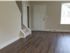 Living area and front door to a two-bedroom townhome at Reserve at Sawmill.