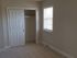 Empty and bright room and closet at Reserve at Sawmill.