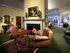 Welcoming lobby at Highlands-at-Warwick with a fireplace and inviting chairs in the living room area.