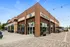 Exterior view of a Starbucks coffee shop near Lofts at Yard 56, featuring a modern design and outdoor seating area.