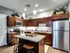 Stylish kitchen in Union Flats showcasing stainless steel appliances and sleek granite countertops.