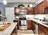Stylish kitchen in Union Flats showcasing stainless steel appliances and sleek granite countertops.