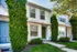 Two-story townhouse at Perkins Place Apartments, featuring a well-kept front yard and inviting entrance.
