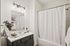 Elegant bathroom with modern fixtures, stylish vanity, and inviting shower area, perfect for relaxation at Emerson Flats.