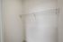Spacious walk-in closet with sleek wire shelving, ideal for maximizing storage in style at Emerson Flats.