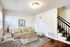 Inviting living room with elegant decor, plush seating, and chic lighting, perfect for relaxation and entertaining.