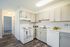 Bright, modern kitchen with sleek cabinetry, elegant countertops, and stainless steel appliances.