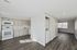 Bright modern apartment at The Village of Carrollwood with sleek kitchen, stainless steel appliances, and open living space.