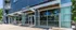 Charming urban storefront with modern glass facade, showcasing an inviting and stylish entrance to the vibrant Nora's.