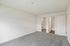 Bright and inviting bedroom with plush carpet, featuring a walk-in closet and an ensuite bathroom for ultimate convenience.