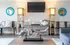 Modern living room with stylish decor, featuring a unique driftwood centerpiece, elegant sideboard, contemporary sculptures, and cozy seating.