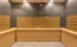 Elegant mailroom with golden mailboxes and geometric wallpaper, providing a stylish, organized parcel solution.