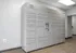 Modern apartment package locker system with sleek design and secure storage options.