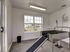 Bright and functional pet washing station with a stainless-steel tub and playful wall art, perfect for grooming and pampering pets.