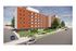 Modern apartment building with vibrant red brick facade, lush green landscaping, and spacious sidewalks in a lively neighborhood.