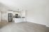 Sleek modern kitchen with stainless steel appliances, elegant cabinetry, and a spacious open-concept layout offering a bright, inviting atmosphere.