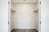 Spacious walk-in closet with ample shelving and hanging space, ideal for maximizing storage in your dream apartment.