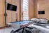 A pool table in a room with a TV. Enjoy a game of pool while watching your favorite shows at Model Tobacco Lofts.
