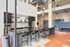 Gourmet kitchen in the clubhouse with island seating at Model Tobacco Lofts.