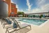 Poolside relaxation with lounge chairs at Model Tobacco Lofts in Richmond.