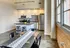 Interior of a kitchen with seating at Model Tobacco Lofts in Richmond.
