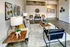 Model Tobacco Lofts living room with couch, coffee table, and two chairs