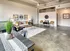 Stylish living room featuring table, chairs, and couch at Model Tobacco Lofts.