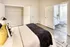 Bedroom on-suite with tub and concrete floors at Model Tobacco Lofts.