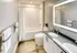 Double sink vanity and tub shower combo in recently renovated bathroom at Model Tobacco Lofts in Richmond.