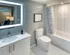 A modern bathroom with toilet, sink, and shower at Model Tobacco Lofts.