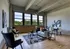 Cozy living room with hardwood floors and large windows at Model Tobacco Lofts.