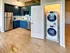 A kitchen with a washer and dryer at Model Tobacco Lofts in Richmond, VA.